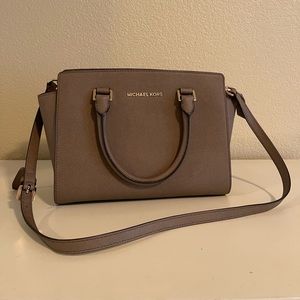 Michael Kors saffiano leather handbag with crossbody strap attachment.